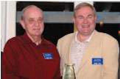 Rick Johnson, COO of O&S Trucking, left, and Jim O’Neal, president, accept Commercial Carrier Journal’s Innovator of the Year award at the annual CCJ Innovators Summit.