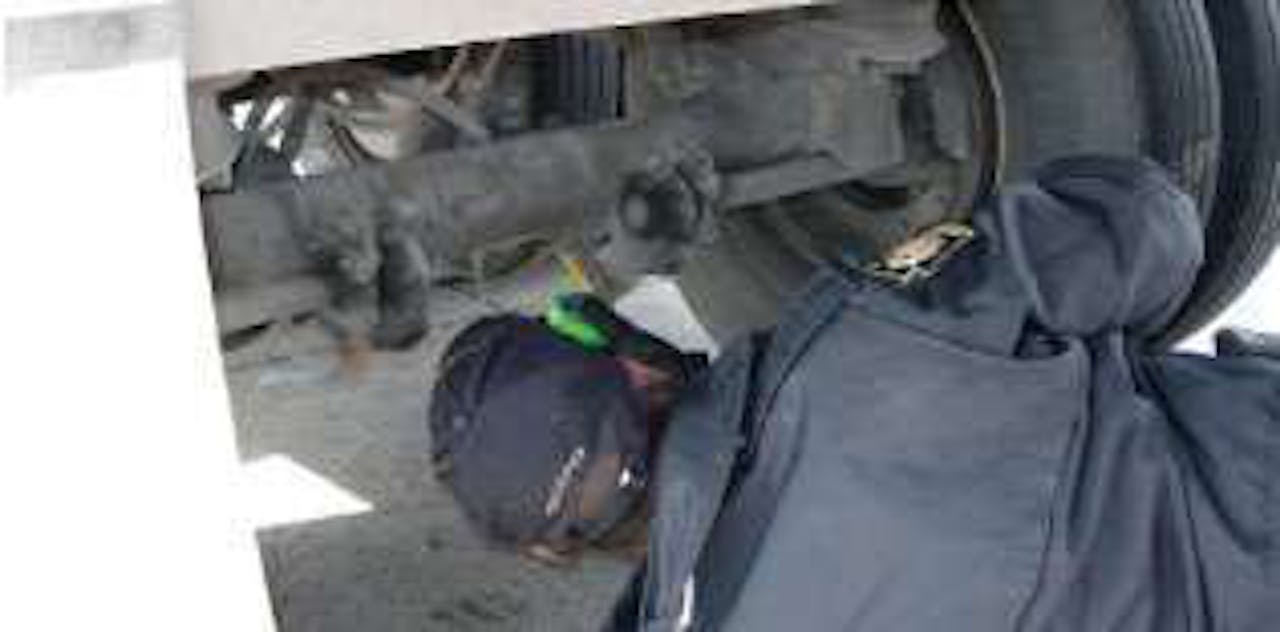 Hodges marks every pushrod, then checks brake-stroke as the driver applies the brakes.