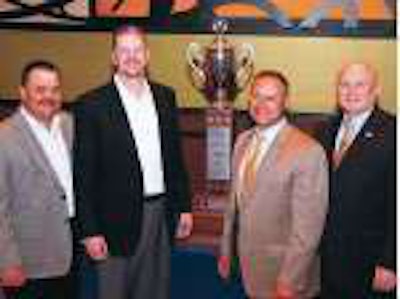 Andrews Logistics received the 2009 Outstanding Performance Trophy from the National Tank Truck Carriers association, NTTC’s top safety prize. Shown from left are Griff Odgers, ALI vice president of safety and risk management; J. Darron Eschle, ALI chairman and CEO; Greg Hewitt, president of Heil Trailer International, sponsor of the award and trophy; and John Conley, NTTC president.