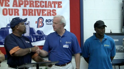 Boyd Bros. President Richard Bailey (middle), congratulates drivers Virgil Shell (left) and Dennis Howard (right) for safely reaching the two-million-mile mark for the company.