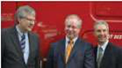 U.S. Xpress CEO Max Fuller received his 50,000th Freightliner during an Aug. 5 ceremony. Pictured, from left, are Martin Daum, president and CEO of Daimler Trucks North America; Fuller; and Mark Lampert, DTNA senior vice president of sales and marketing.