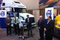 Ron Huibers, Volvo Trucks' senior vice president of sales and marketing (middle), honors representatives of Upper Lakes Foods and MacKinnon Transport with the Volvo Trucks Safety Award.