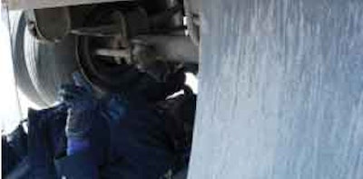 Hodges marks every pushrod, then checks brake-stroke as the driver applies the brakes.