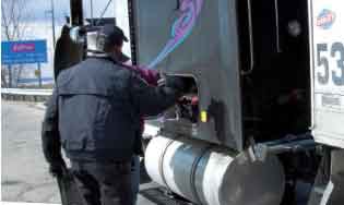 Here, Hodges asks the driver to open the storage compartment. One part of an inspection is checking for the required onboard safety equipment, which includes items such as a fire extinguisher and reflectors.