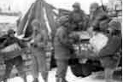 Red Ball Express drivers load supplies to deliver to troops on the front line.