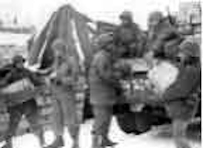 Red Ball Express drivers load supplies to deliver to troops on the front line.