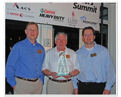 Marten Transport officials accept the CCJ Innovator of the Year award at the CCJ Innovators Summit at the Hawks Cay Resort in the Florida Keys. Shown, from left, are Doug Petit, executive vice president; Bob Jones, chief operating officer; and Dave Meyer, director of maintenance.