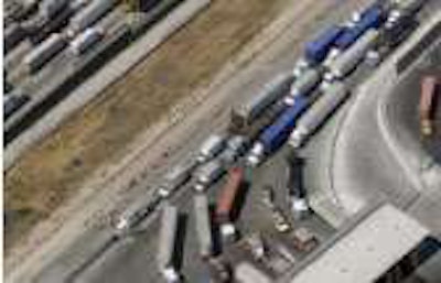 Trucks line up waiting to cross into the United States from Tijuana, Mexico.