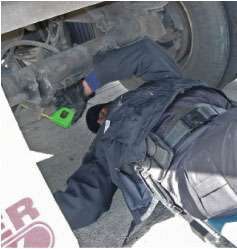 Safety inspections need to be carried out safely, so inspectors carry wheel chocks since service brakes must be checked with the parking brake off. Creepers allow them to move freely under tractor and trailer to check items such as brakes and suspensions.