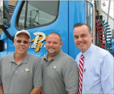 Dave Ward, right, with employees Tom Gerwig, left, and Craig Powers, says Price-Tran drivers do all of the unloading and reloading of freight themselves at the company’s two terminals.