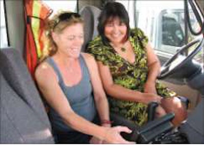 Dorothy Vankoughnett, IT manager and controller for Berry & Smith Trucking, reviews ECM data with Dina Elder, the company’s safety/driver liaison.