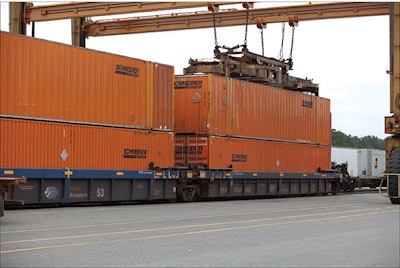 Schneider National works with customers to specify that high-value loads be placed on the bottom position of the well of a double-stack rail car to prevent thieves from opening container doors.