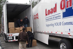 Load One Trucks And People Unloading Them