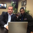 John Elliott, president of Load One, with a driver. Load One uses several cloud-based software systems and has a completely virtual IT network.