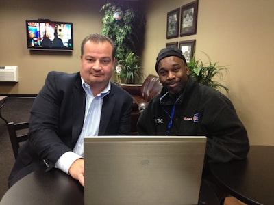 John Elliott, president of Load One, with a driver. Load One uses several cloud-based software systems and has a completely virtual IT network.