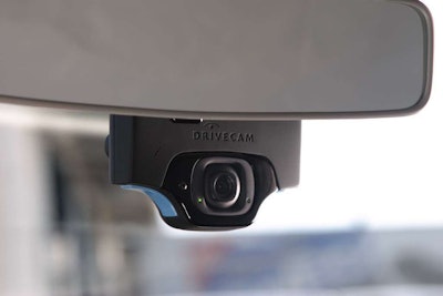 DriveCam’s system uses a window-mounted recording device that captures forward and cab-facing video.