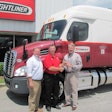 Dale Williams, center, a driver-instructor for Trimac Transportation and a 2013-14 ATA America’s Road Team Captain, gets the keys to his new 2014 Freightliner Cascadia from Josh Wood, left, general sales manager for Birmingham Freightliner, and Mike Thompson, the dealership’s general manager.