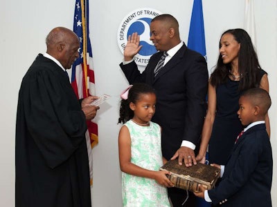 Anthony Foxx being sworn in as Secretary of Transportation, with wife Samara and children Hillary and Zachary.