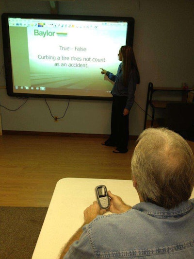 Baylor Trucking drivers going through orientation attend a high-tech classroom complete with a “smart board” where they watch video clips and use a remote-control device to answer questions.
