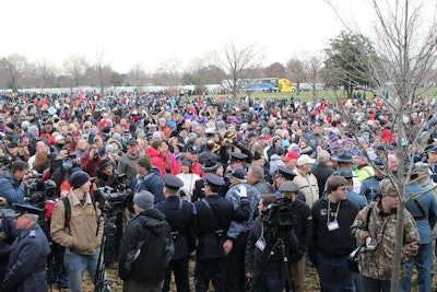 Volunteers gather for the opening ceremony at Arlington National Cemetery. The American Trucking Associations’ Share the Road Truck can be seen in the background. This was one of several trucks who participated in a special convoy from Maine to Arlington, stopping at schools, monuments, veterans’ homes and communities along the way.