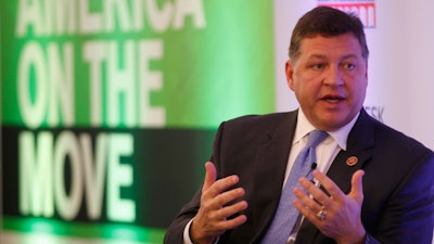 Shuster speaking to an audience at an infrastructure conference earlier this week. (Photo from Bloomberg)