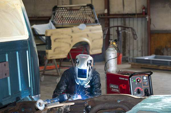 Warren Spears making repairs on an older F-150.