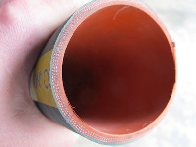 Due to an electrochemical reaction, coolant hoses tend to deteriorate from the inside out, shedding material into the liquid. To inspect a coolant hose, use a finger and thumb to feel for sponginess or weak spots.