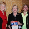 Award winner Marcia Taylor, center, is joined by Ellen Voie of Women in Trucking, left, and Navistar’s Jan Allman.