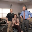 Bob Peterson, president of Tulsa, Okla.-based flatbed carrier Melton Truck Lines (right), works with Bret Bringham, the company’s wellness manager and personal trainer (left), and Angie Buchanan, vice president of safety and human resources on the company’s various health and wellness initiatives.