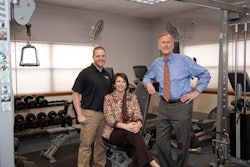 Bob Peterson, president of Tulsa, Okla.-based flatbed carrier Melton Truck Lines (right), works with Bret Bringham, the company’s wellness manager and personal trainer (left), and Angie Buchanan, vice president of safety and human resources on the company’s various health and wellness initiatives.