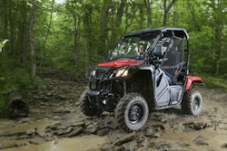 Honda’s 2015 Pioneer 500 has 9.6″ of ground clearance, four-wheel-drive, an electric 5-speed with paddle-shifters, and a 1,000-lb. towing capacity.