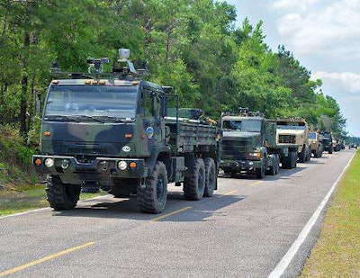 A driverless truck convoy moves along a South Carolina road in a U.S. Army test of Lockheed Martin’s Autonomous Mobility Applique System. (PRNewsFoto/Lockheed Martin)