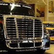 Two ChampTuck-style Freightliners equipped for the circuit.