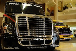 Two ChampTuck-style Freightliners equipped for the circuit.