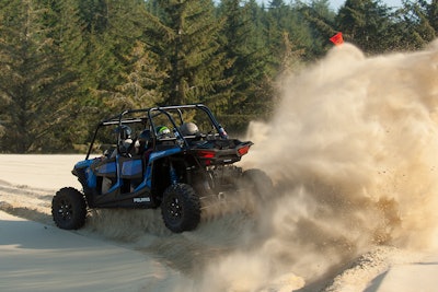 With 18″ of rear suspension travel, 13″ of ground clearance, and 110hp, the four-passenger Polaris XP 4 chews up the sand.