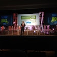 CLICK to view a photo gallery of TransForum. David Wangler, CEO of TMW Systems, talked about the many charitable contributions made by trucking companies.
