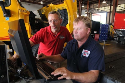 Steve Arnold, left, corporate trainer for Truck Centers of Arkansas, instigated a new mentoring program designed to both help new recruits and retain existing ones.
