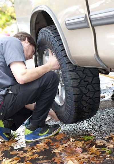 Nitto EXO Grappler AWTs going on customer’s truck at the Eugene Tire Factory after tread depth on old tires was found to be only 3/32″.