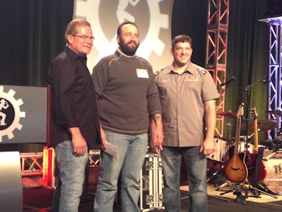 Erick Lincoln (middle) with NASCAR driver Tony Stewart (right) and Rush Truck Center CEO Rusty Rush (left).