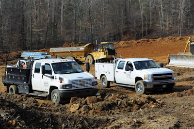 Hwy build jobsite trucks