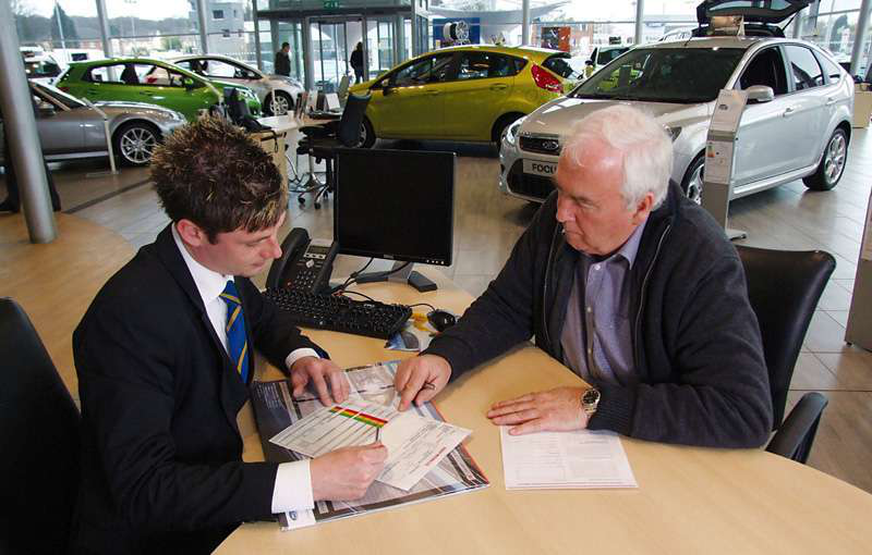 Dealer at desk Ford