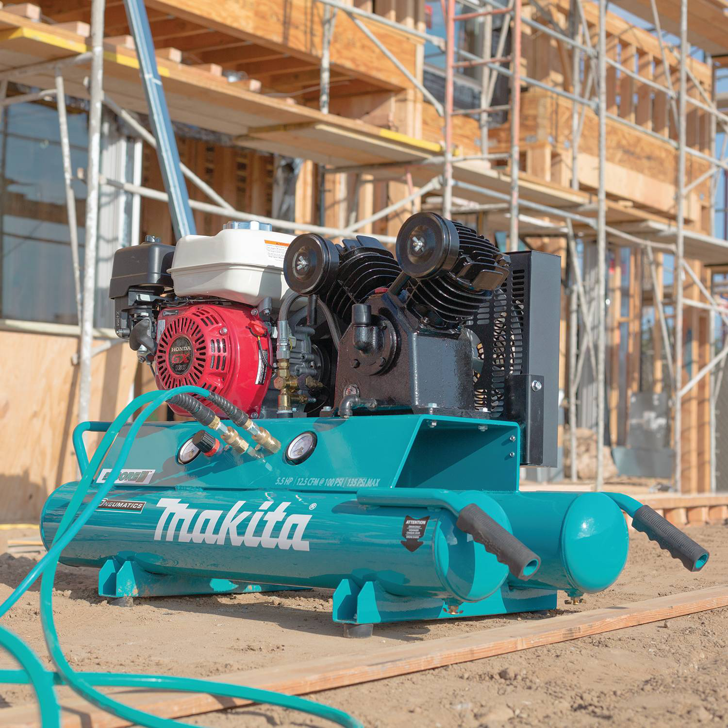 Makita MAC5501G is HOnda-powered and has a wheel in front for easy transport.