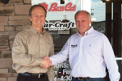 Correct Craft’s President and CEO Bill Yeargin (left) and Bass Cat President Rick Pierce reach mutual agreement on boat builder merger.