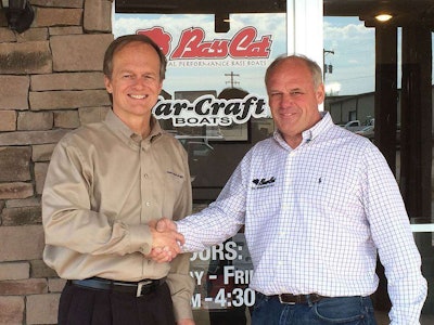 Correct Craft’s President and CEO Bill Yeargin (left) and Bass Cat President Rick Pierce reach mutual agreement on boat builder merger.
