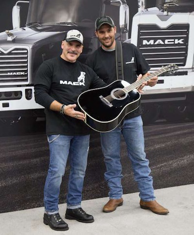 Mariani (left) presents Stroud with the Martin D-35