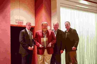Dean Newell, vice president of safety and training for Maverick Transportation, LLC, of North Little Rock, Ark., was named TCA’s Safety Professional of the Year. Shown are TCA President Brad Bentley, Newell, Rande Walker and John Joines.