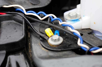 The only 'wiring' we had to do was to attach the ground lug to a body bolt and connect the hot lead (red wire) to one of the two wires we had running from the Buyer's switch box in the cab. We used the blue wire for the SR-30 and the white one for the D2 LED driving lights.