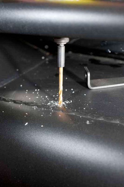 Position and mark location of mounting tab hole. Drill a pilot hole for the self-tapping screws that will be used to mount the supplied Rigid mounting tabs to the Fab Fours Black Steel Elite HD bumper.