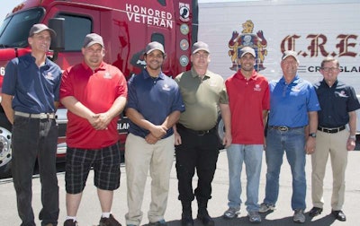 C.R. England adds six new trucks to its Honored Veterans military-themed Fleet. (Left to Right) Drivers: Darryl Wright, Josh Smith, Hardrick Crawford, Chris Yates, Jeremy Jellison, Steve Calder; C.R. England Chairman Dan England (PRNewsFoto/C.R. England, Inc.)