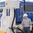 Truck driver fueling up at a Shell LNG pump